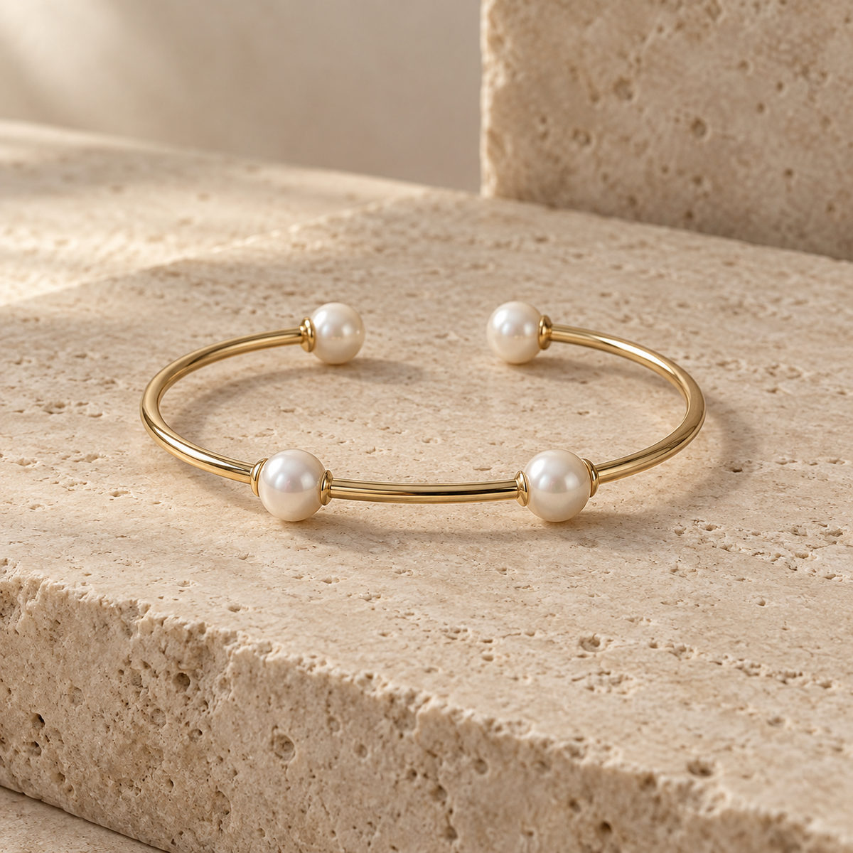 Élan Pearl Tennis Bracelet on warm travertine