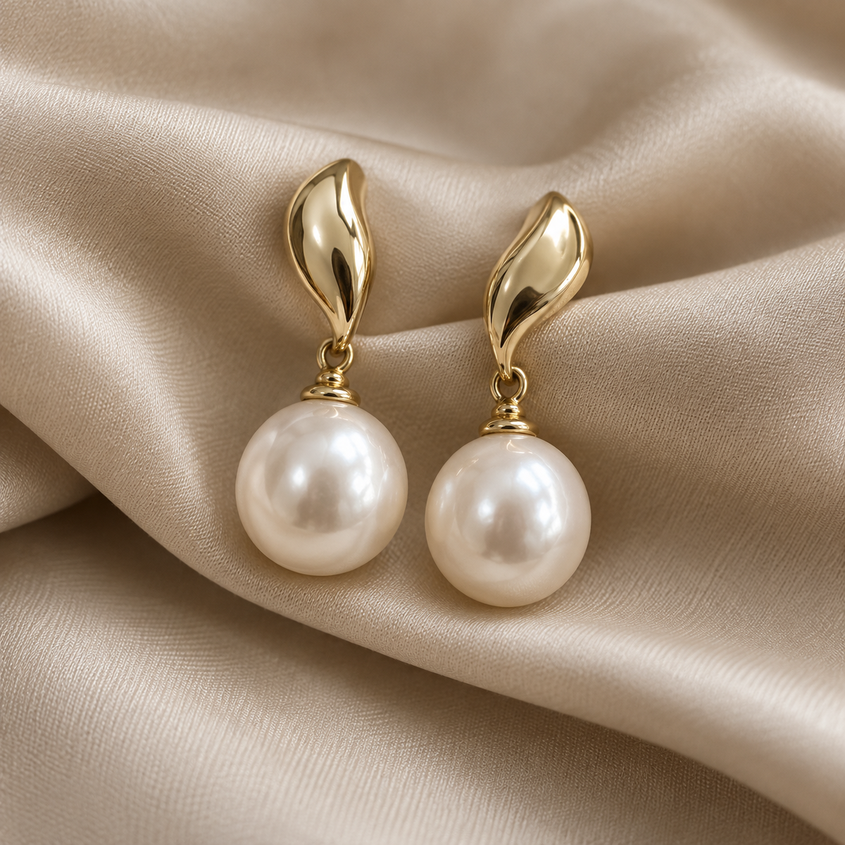 Nocturne Pearl Drop Earrings on champagne silk